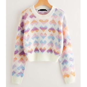 Cozy Pink heart knit pullover sweater. This sweater fits like a crop top.